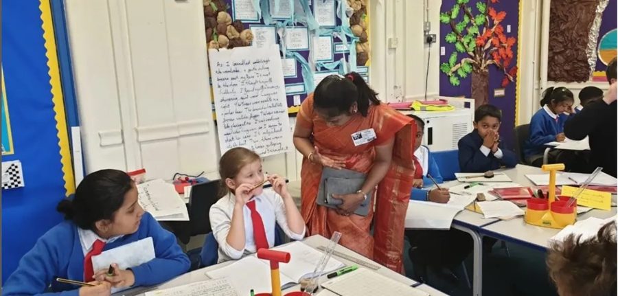 Dr Satyasree Guptaa guiding pupils during a classroom visit